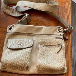 Roots Tan Leather Crossbody Bag with Woven Pocket Detailing